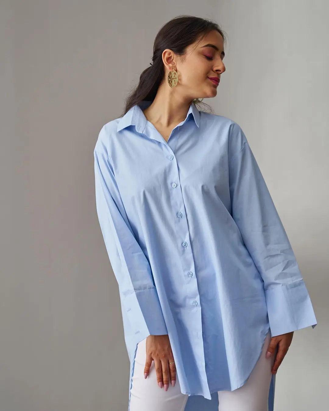 Light blue oversized poplin shirt for women with long sleeves and button-down front