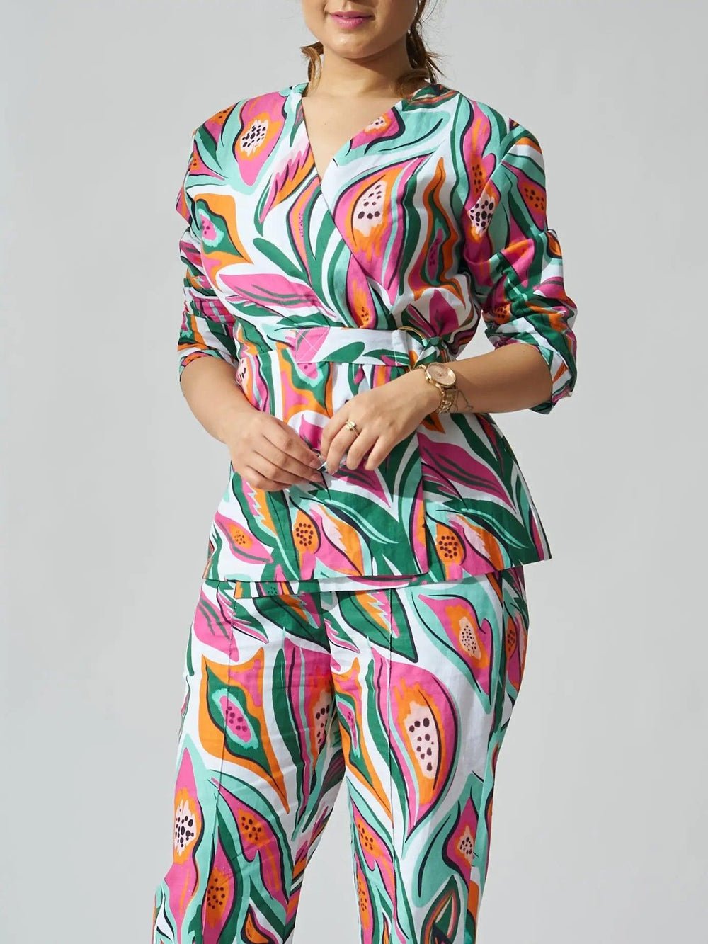 Risate papaya print linen coord set featuring vibrant floral patterns and a stylish peplum top