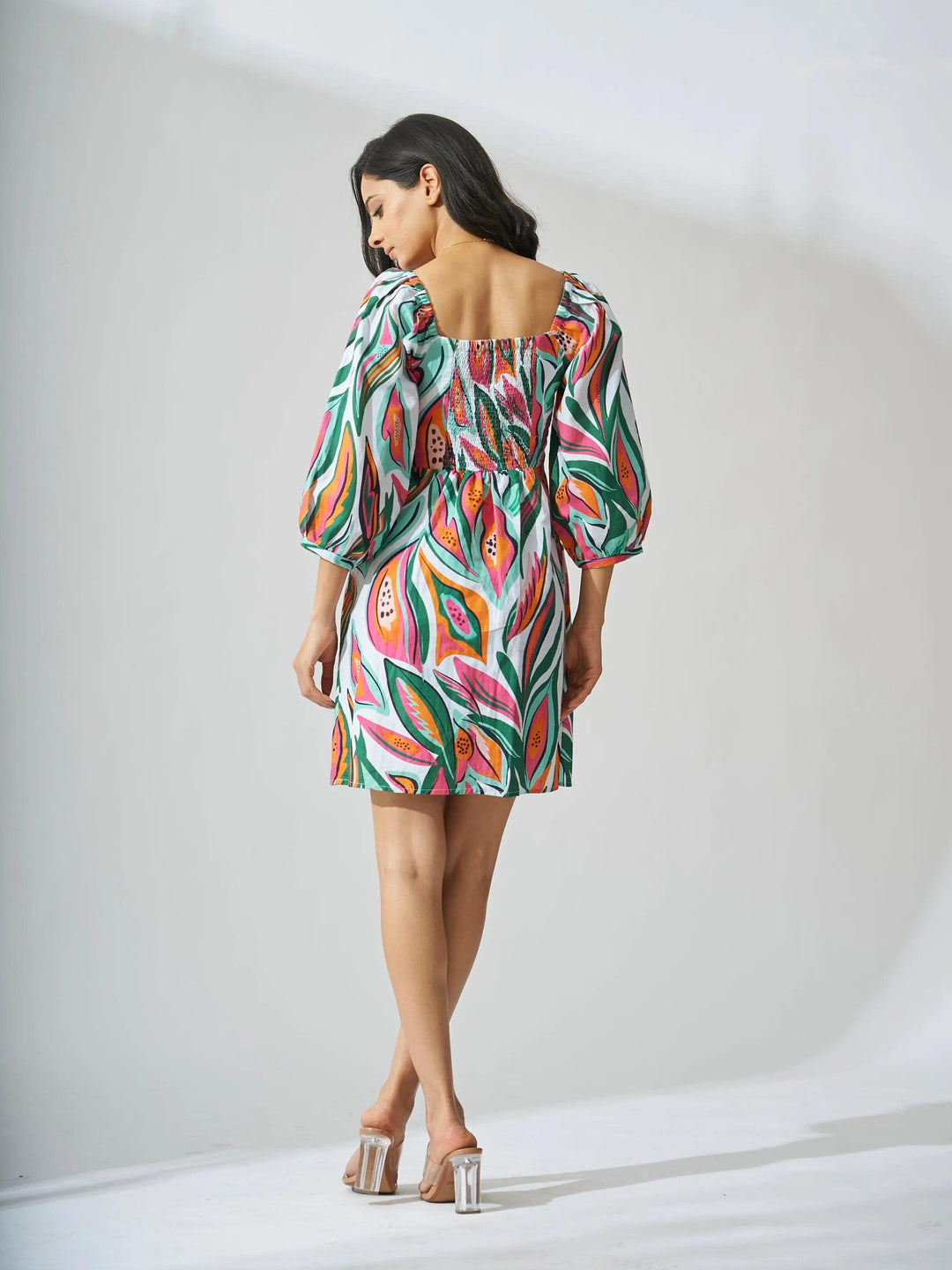 Risate papaya print linen mini dress with puff sleeves and a colorful floral design