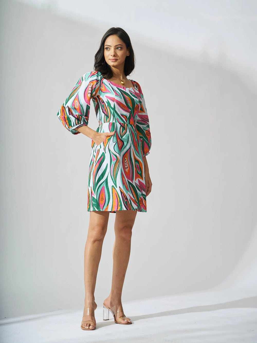 Risate papaya print linen mini dress featuring vibrant colors and a trendy silhouette