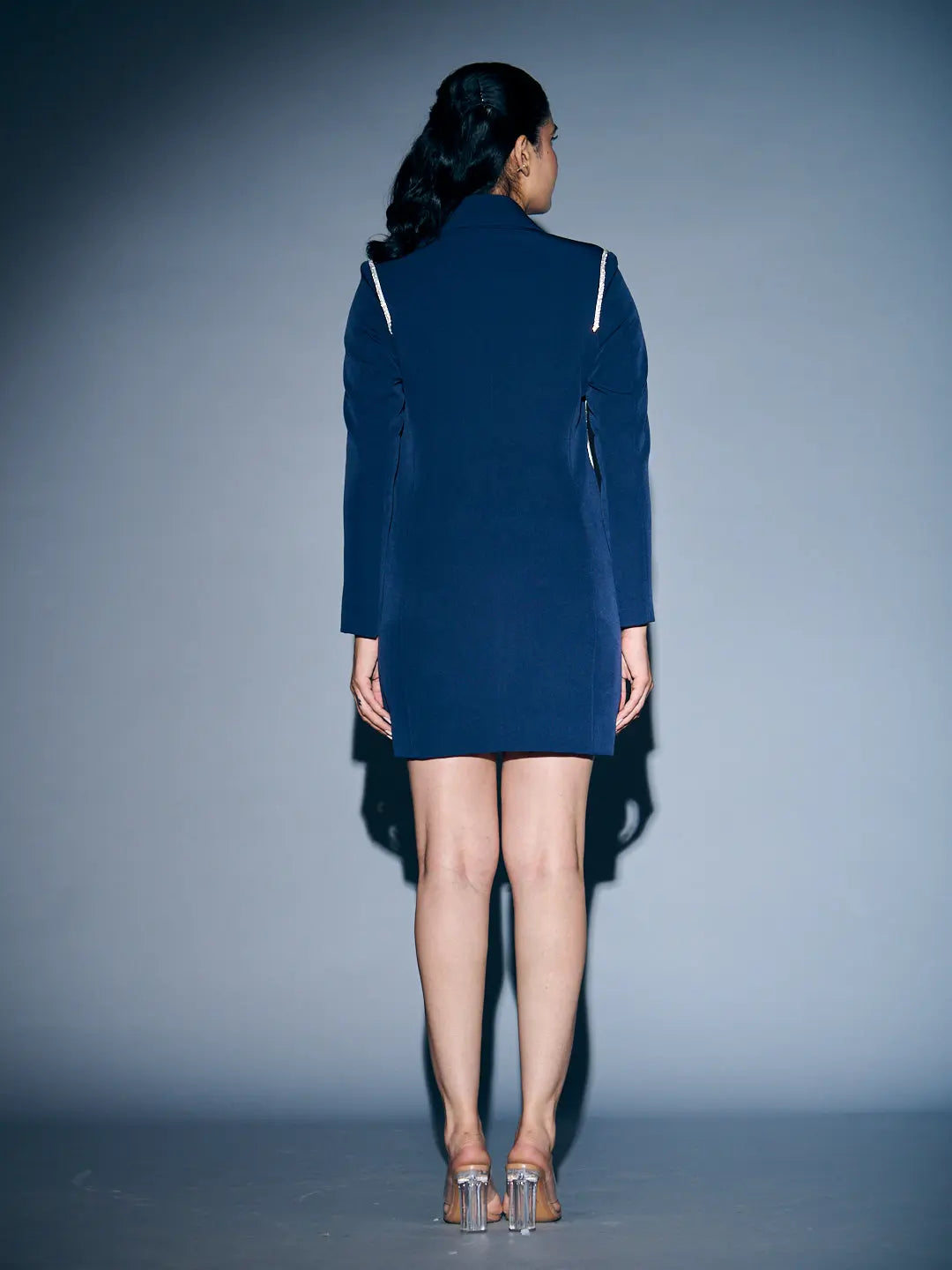 Back view of a stylish Risate rhinestone blazer dress for women in navy blue