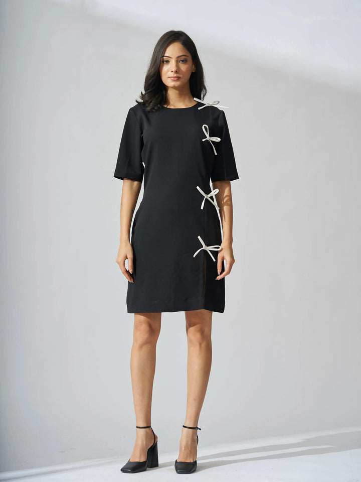 Elegant black Risate rhinestone bow shift dress with stylish bow accents on the sides