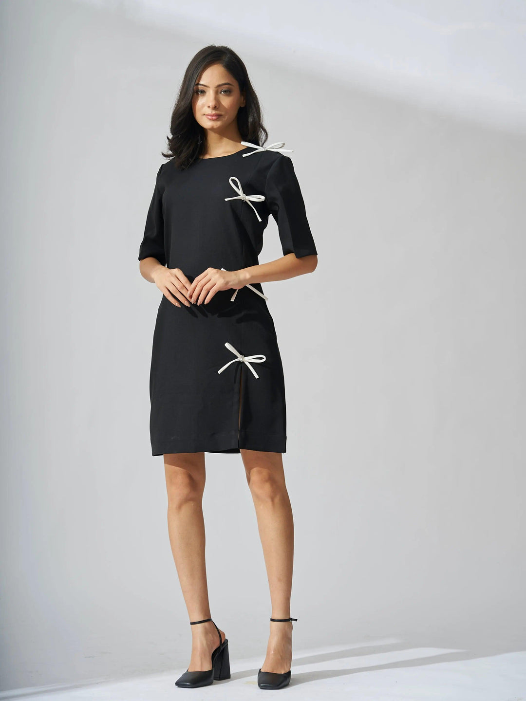 Risate rhinestone bow shift dress in black featuring stylish bow details for a chic look