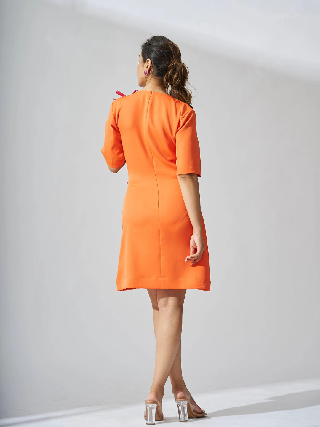 Orange Risate rhinestone bow shift dress with short sleeves and a stylish silhouette