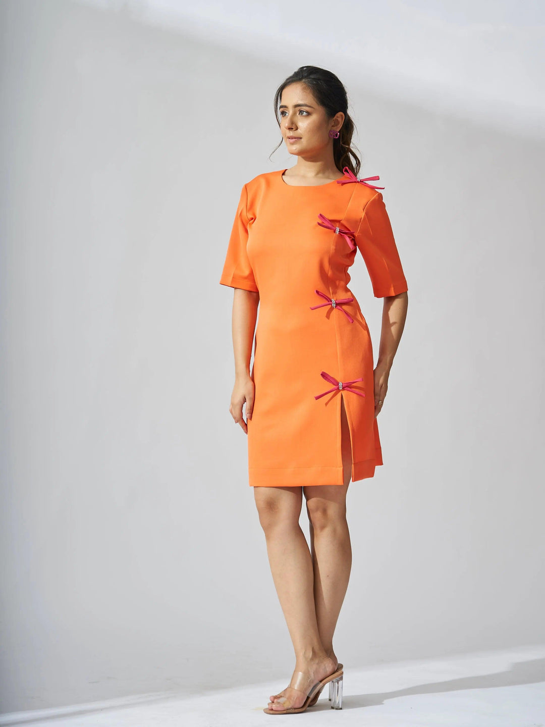 Risate rhinestone bow shift dress in bright orange with stylish bow accents and a modern silhouette