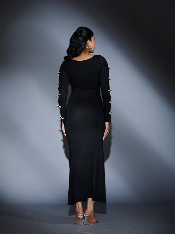 Elegant Risate rhinestone sleeve maxi dress with form-fitting silhouette and stylish back design