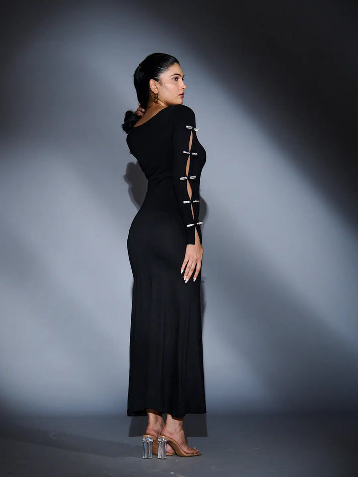 Elegant Risate rhinestone sleeve maxi dress showcasing a slim fit design with cut-out detailing