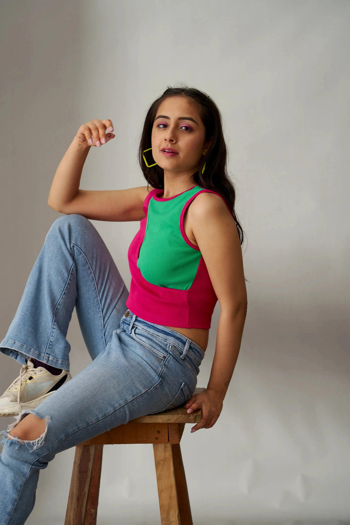 Risate ribbed crop top for women in vibrant green and pink, styled with high-waisted jeans
