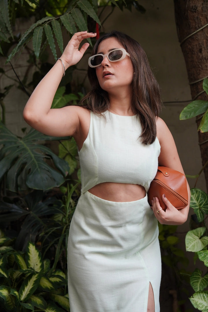 Sage cut out dress by Risate featuring a stylish slit and chic design for modern elegance