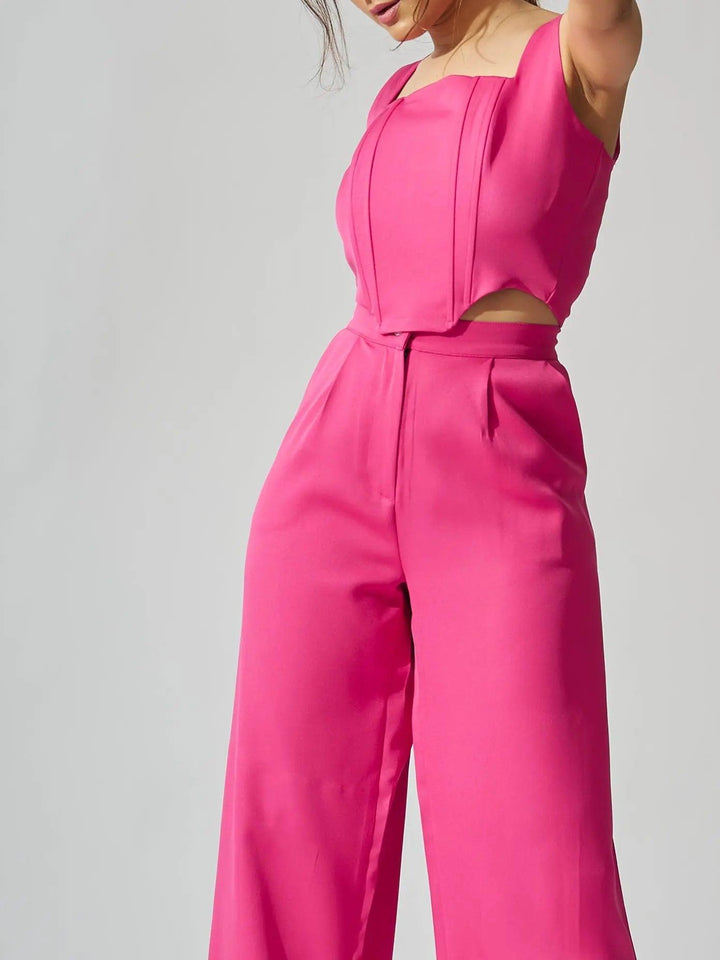 Risate sleeveless corset top and pants set in vibrant pink for a stylish look