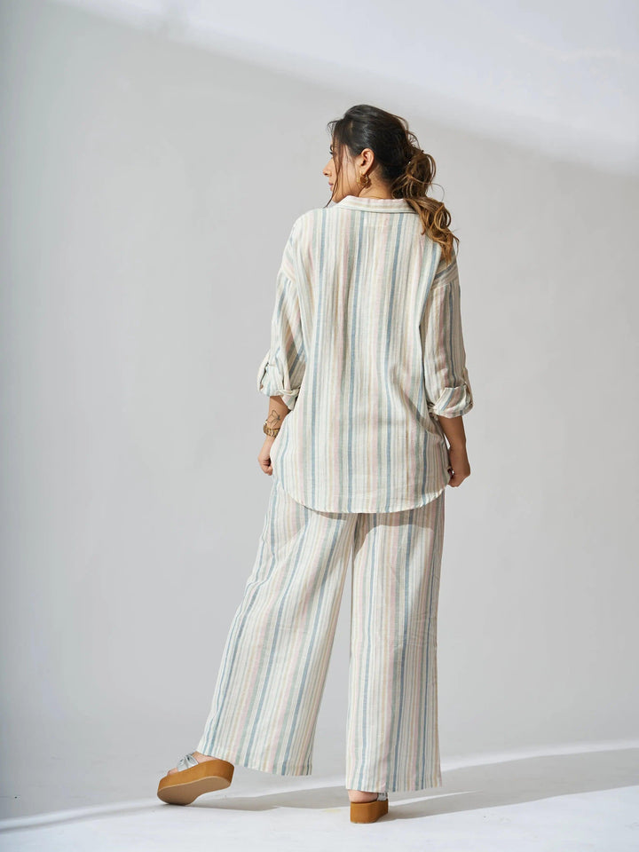 Sunset striped linen shirt and flared pants set in a relaxed fit, perfect for casual outings.