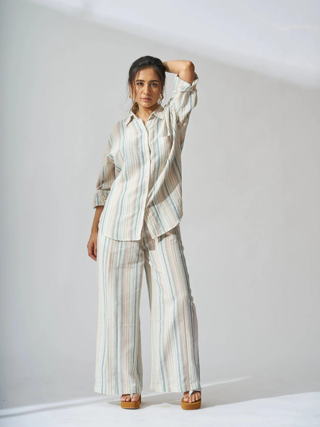 Risate sunset striped linen shirt and flared pants set in soft colors for a stylish summer look