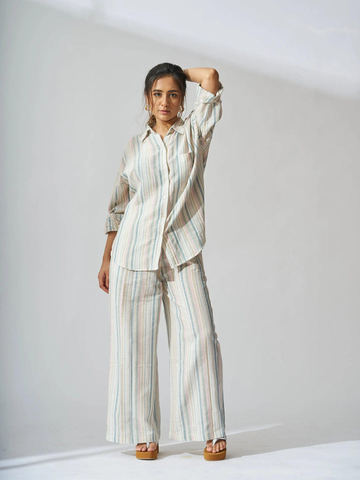 Risate sunset striped linen shirt and flared pants set in soft colors for a stylish summer look