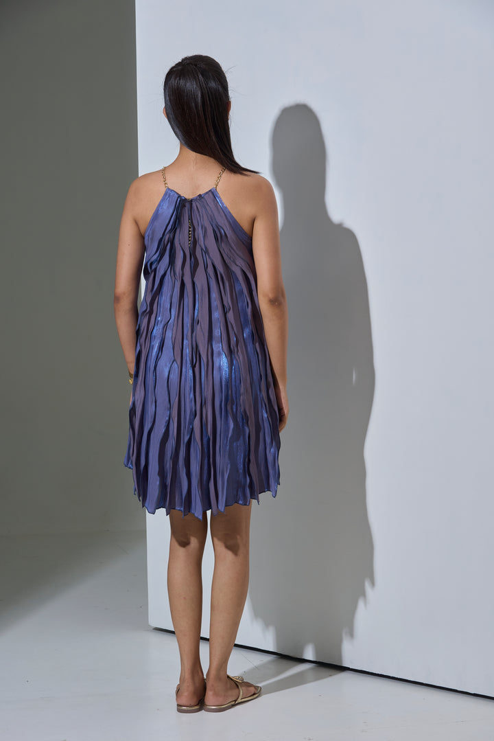 Back view of the Risate Twilight Wave Dress for women with flowing layers in shades of blue
