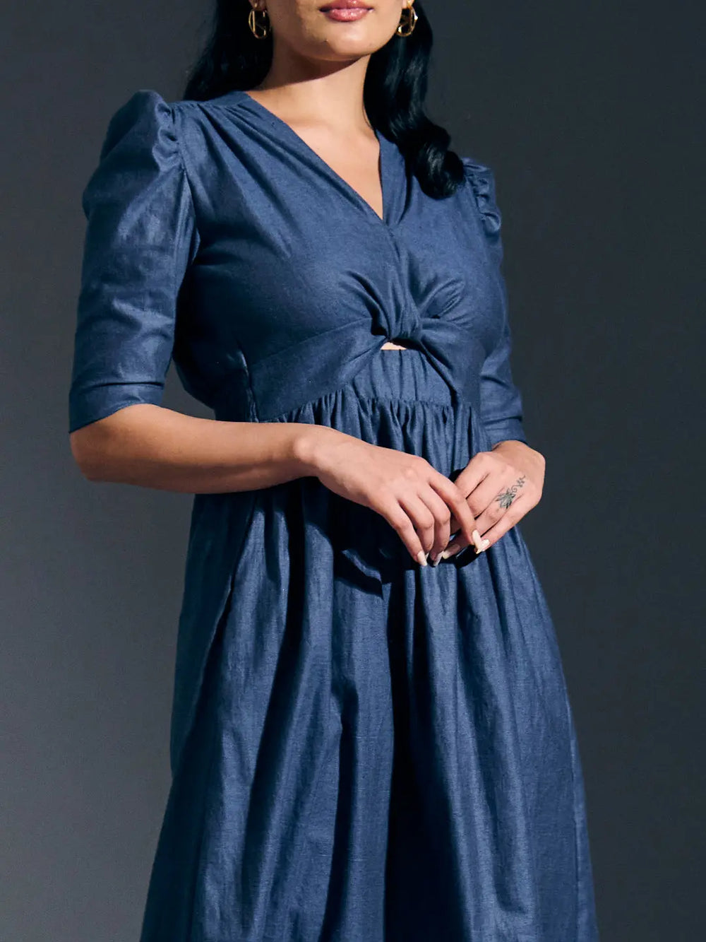 Risate twist detail maxi dress in blue with puff sleeves and a flattering silhouette