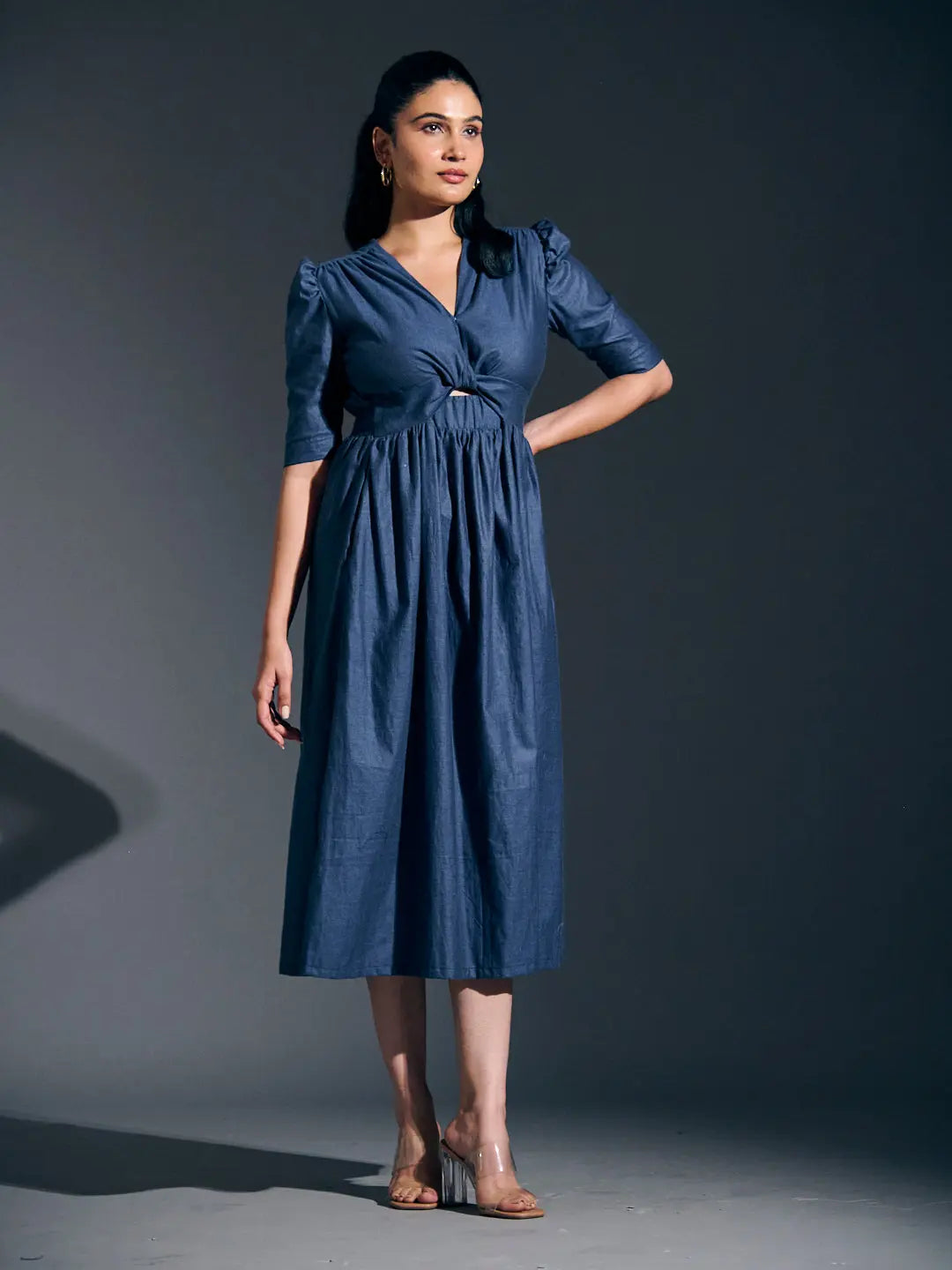 Risate twist detail maxi dress in denim blue with a flattering silhouette and puff sleeves