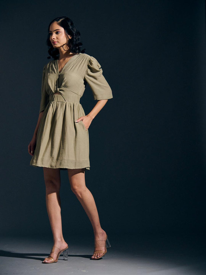 Risate twist detail mini linen dress featuring a v-neck and puff sleeves in a stylish olive green