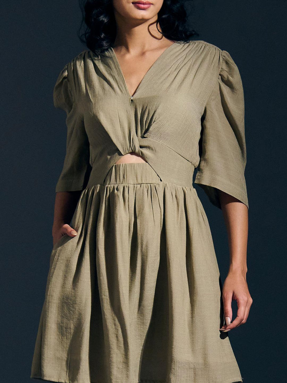 Risate twist detail mini linen dress in olive green with stylish cutout and puffed sleeves