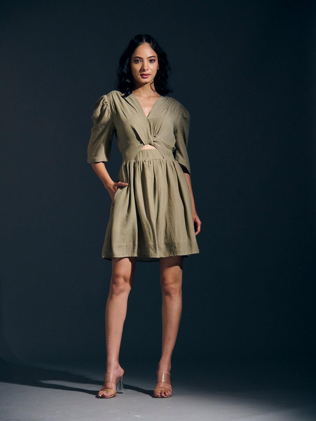 Risate twist detail mini linen dress in olive green with puff sleeves and a cutout waist