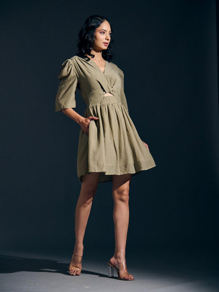 Risate twist detail mini linen dress in olive green featuring puff sleeves and a flattering silhouette