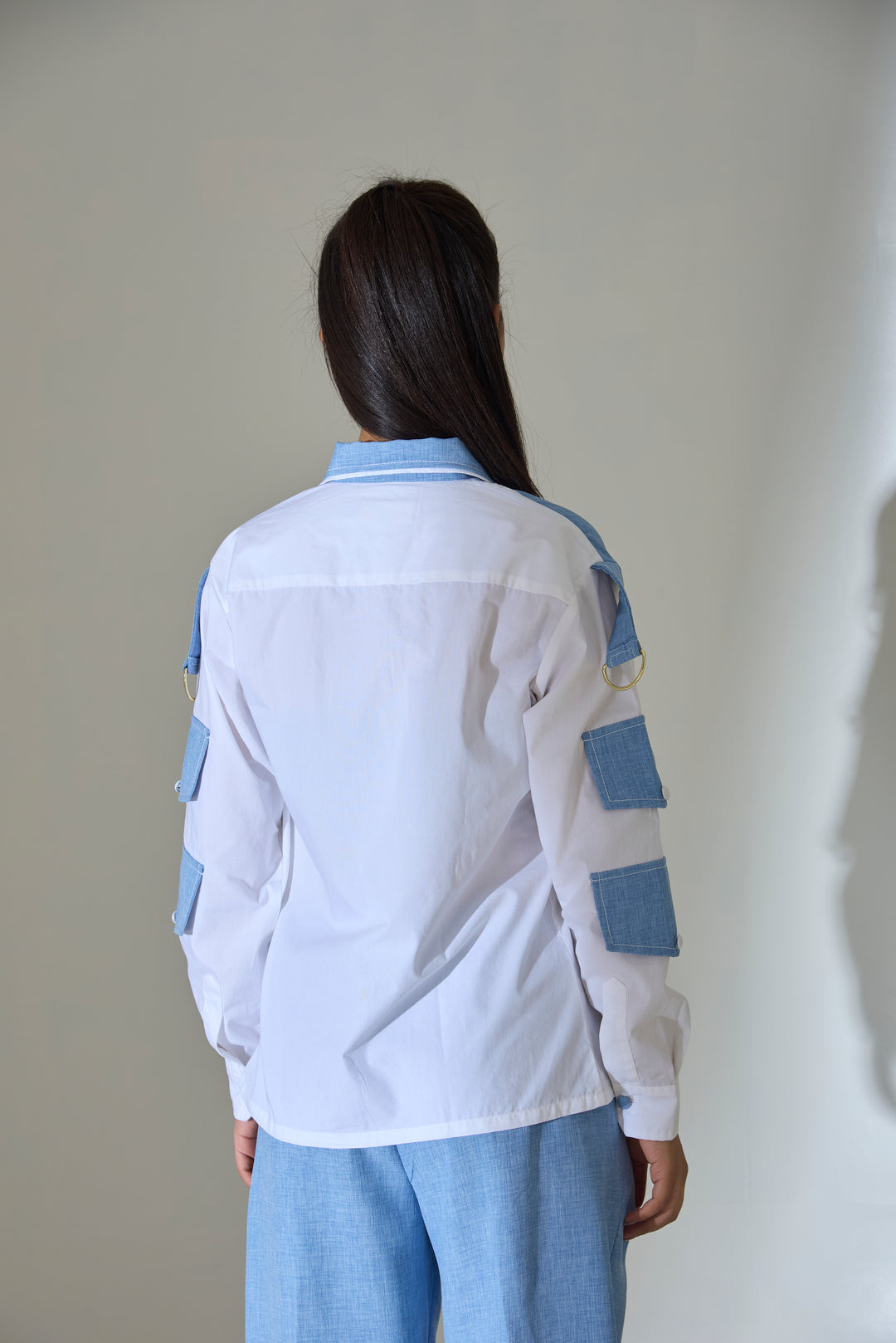 Risate two-tone cotton shirt for women featuring a contrasting design and stylish patch details
