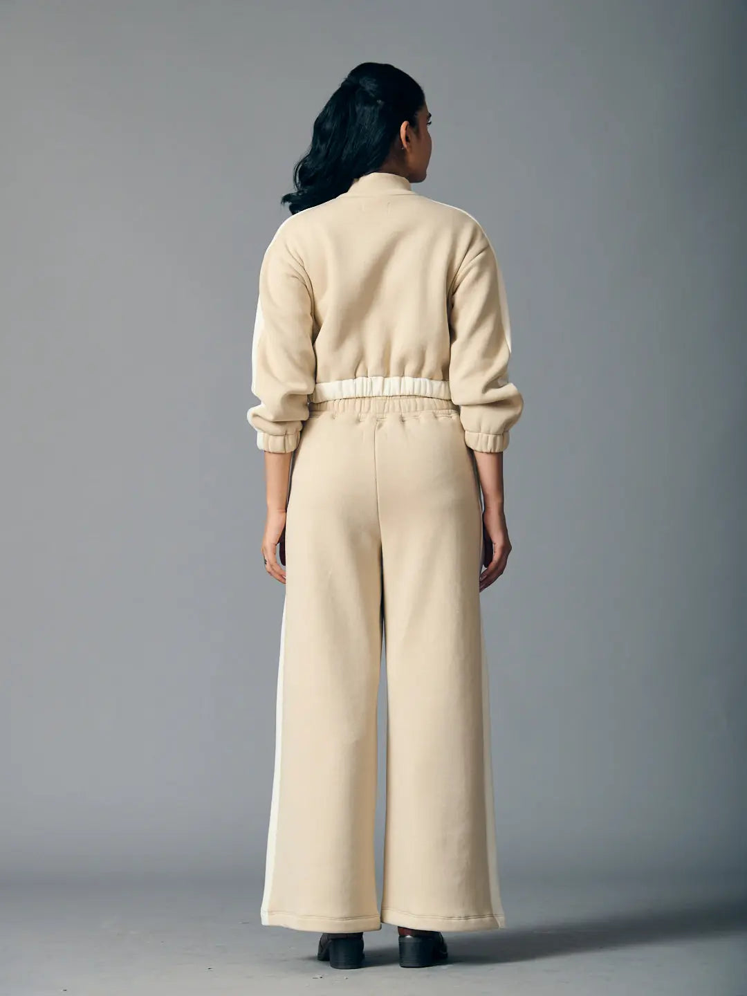 Back view of beige Risate urban chill set for women featuring a cropped jacket and wide-leg pants