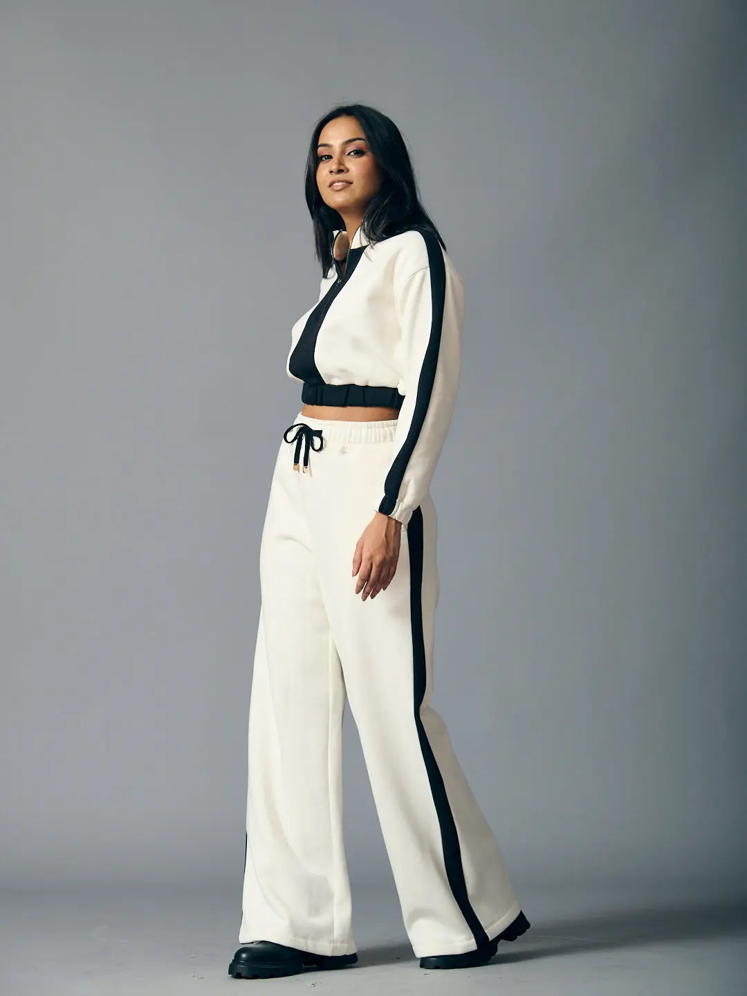 Risate urban chill set for women featuring a cropped zip-up top and wide-leg pants in black and white