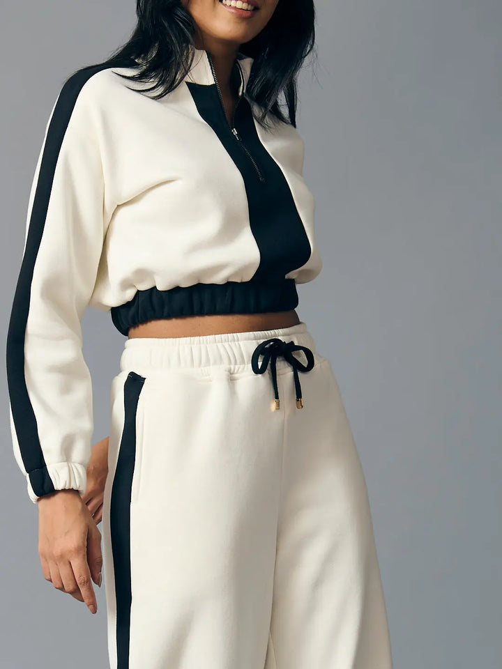Risate Urban Chill Set for women featuring a cropped top and matching joggers in cream with black accents
