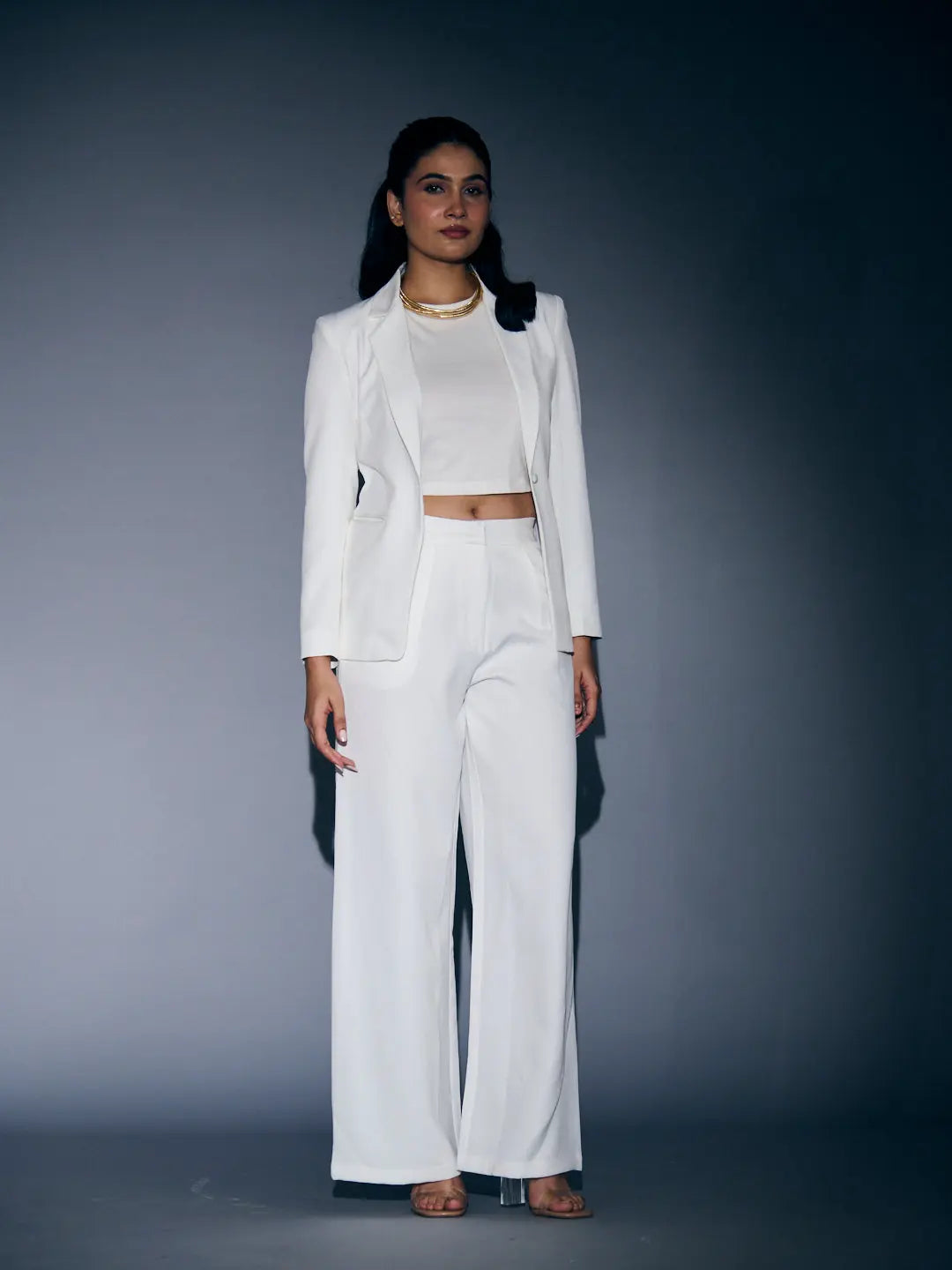 Stylish Risate white blazer and pants set for women with a cropped top, perfect for chic occasions