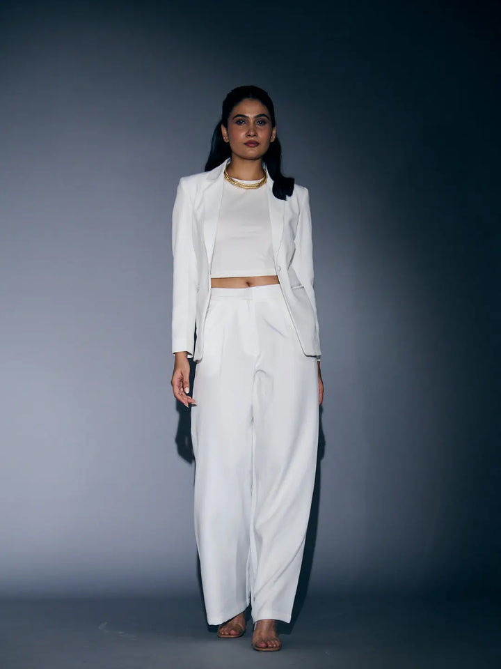 Elegant white blazer and pants set for women featuring a fitted crop top and wide-leg pants