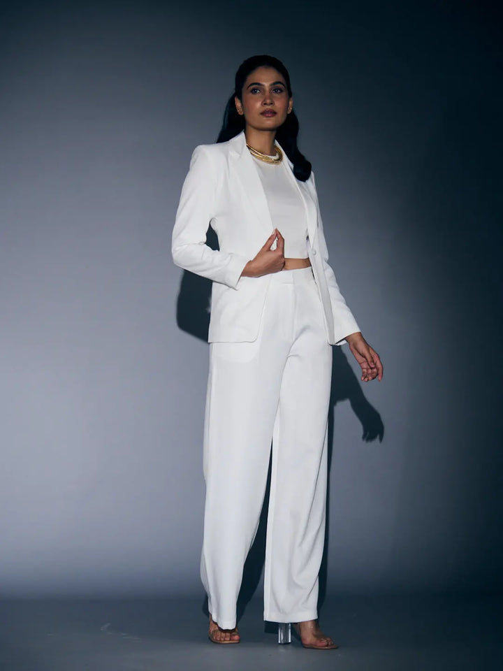 Stylish white blazer and pants set for women featuring a cropped design and elegant silhouette