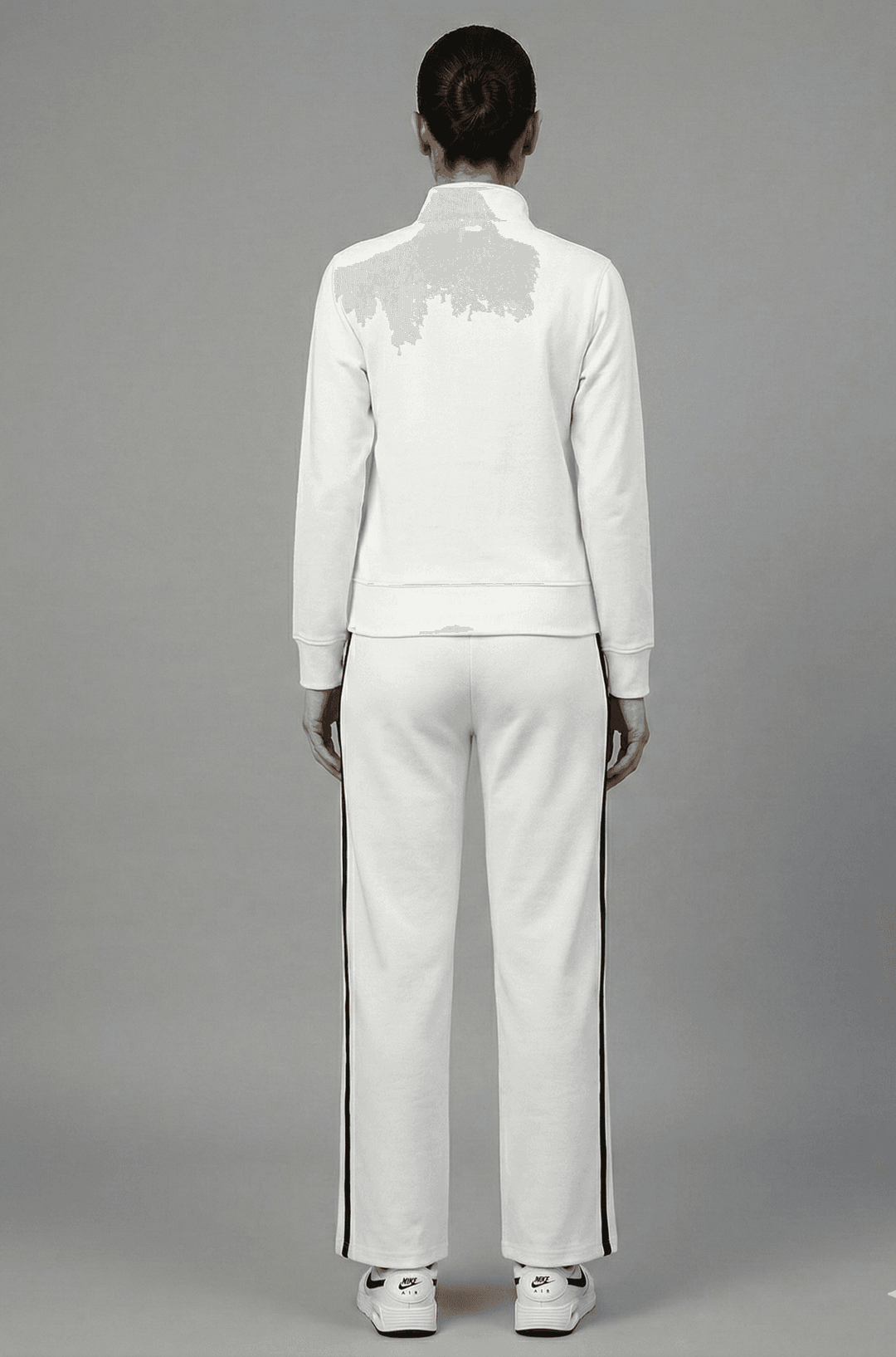 Back view of the Risate white luxe track set for women with a modern design and comfortable fit