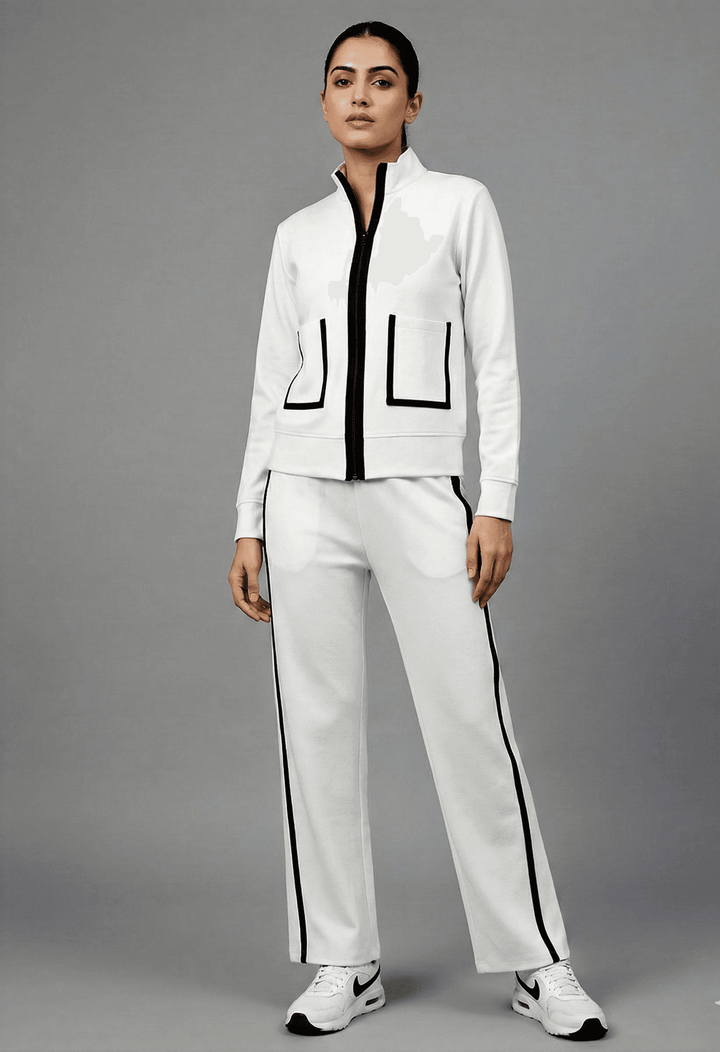 Risate white luxe track set for women featuring a zip-up jacket and matching pants with sleek design