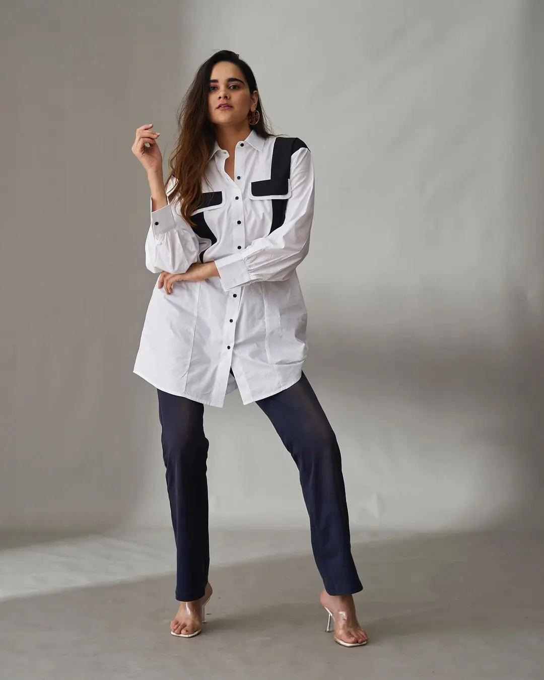 Risate white oversized poplin shirt for women with contrasting black pocket details, perfect for casual elegance