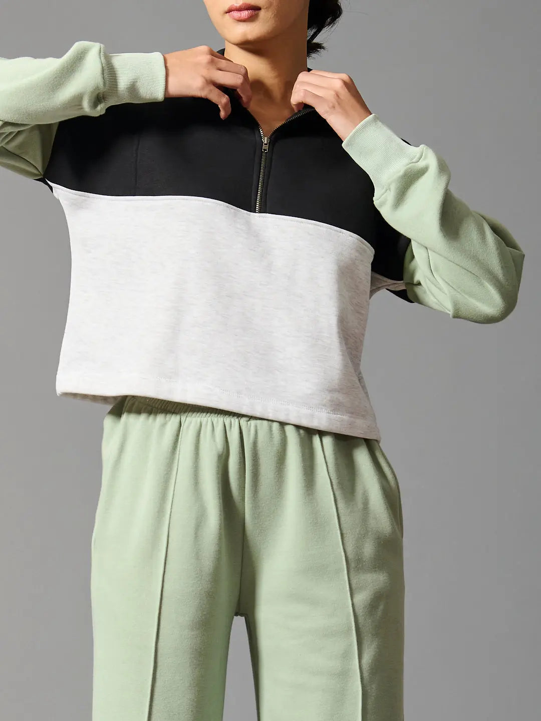 Willows coord set for women featuring a zip-up cropped top and matching pants in green and gray