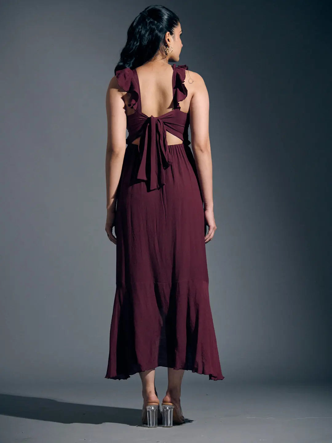 Back view of a Risate wine frill linen dress for women with a tied bow detail and flared hem