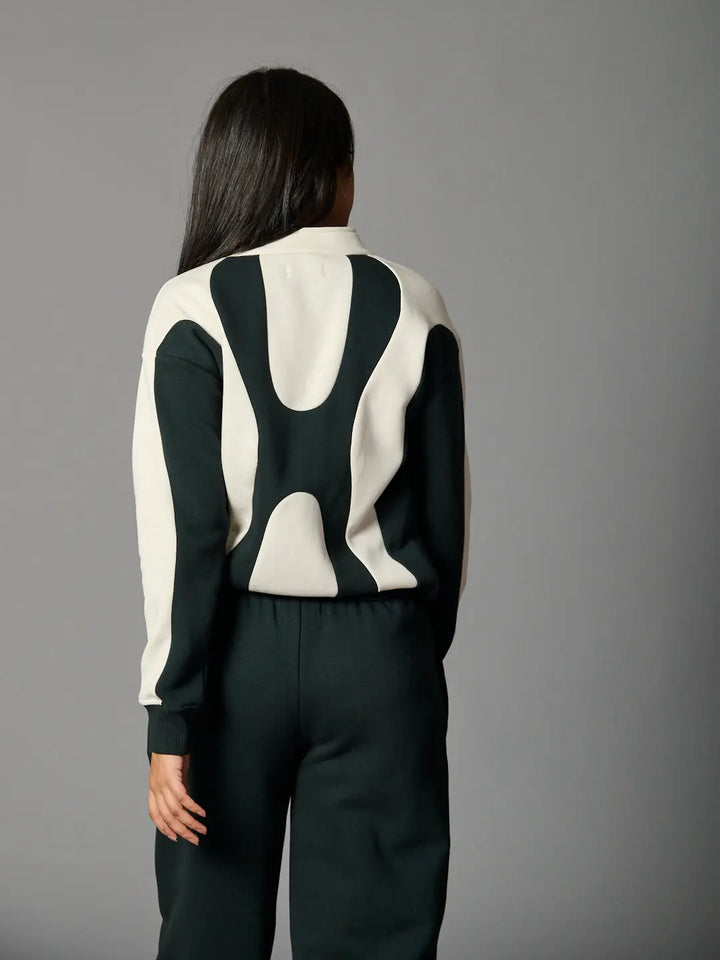 Risate bold edge sweatshirt for women featuring a unique design in black and cream colors