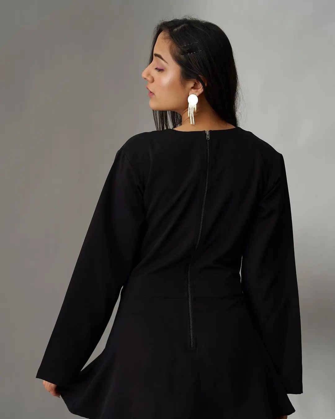 Elegant women's black jumpsuit with long sleeves and a stylish back zipper detail