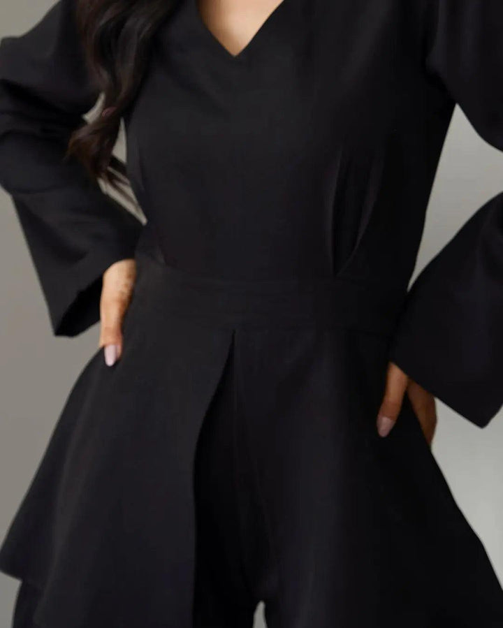 Stylish women's black jumpsuit with flared sleeves and a flattering V-neckline