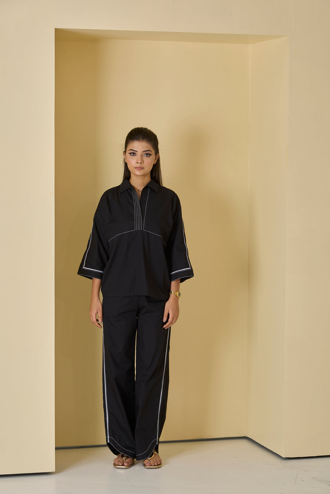 Women's black piped western set featuring a stylish top and matching pants for a chic look.
