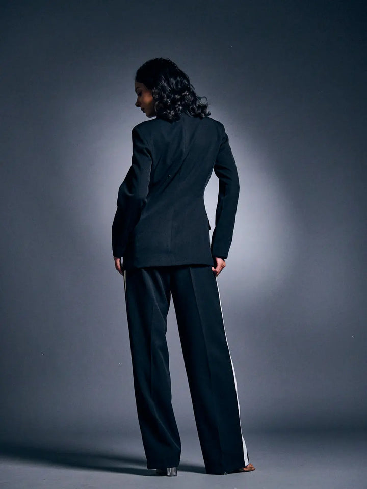 Stylish Risate women's blazer suit set showcased from the back, featuring tailored pants and a fitted blazer