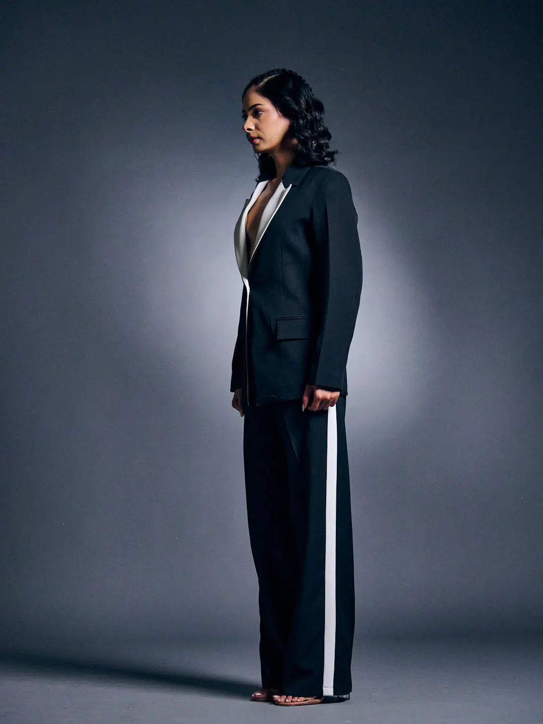 Risate women's blazer suit set in black with white accents, styled for a chic look