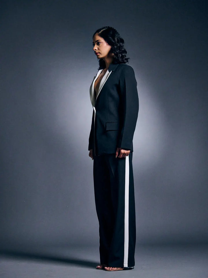 Risate women's blazer suit set in black with white accents, styled for a chic look