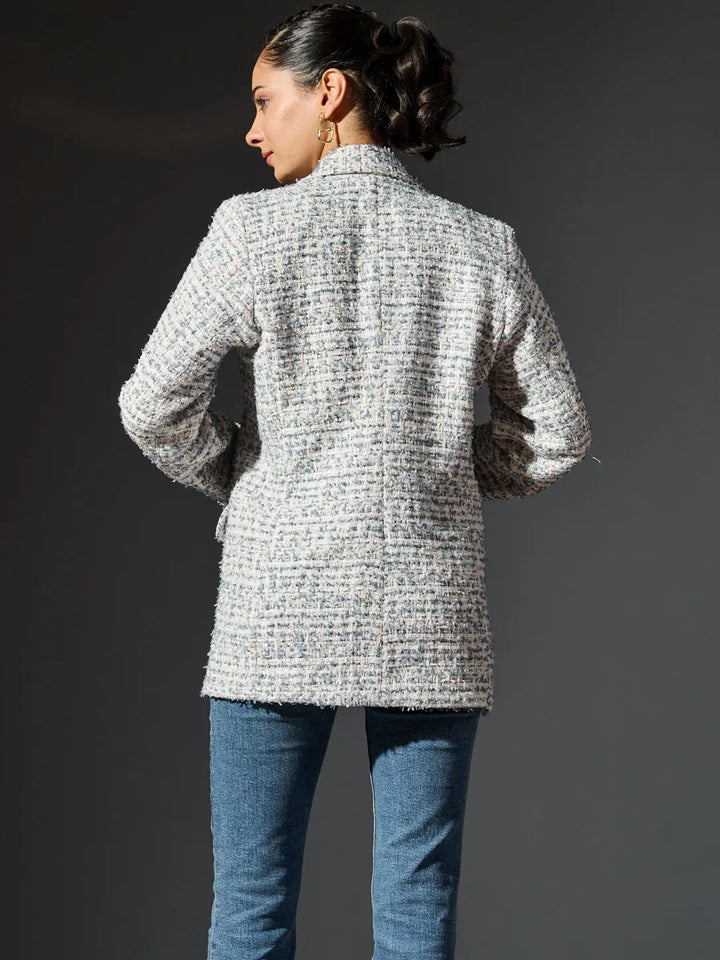 Back view of women's British tweed blazer by Risate, featuring a stylish and elegant design.