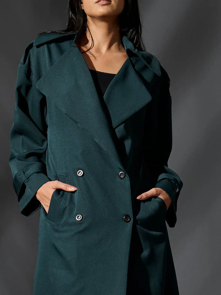 Risate women's classic trench coat in teal with double-breasted buttons and side pockets