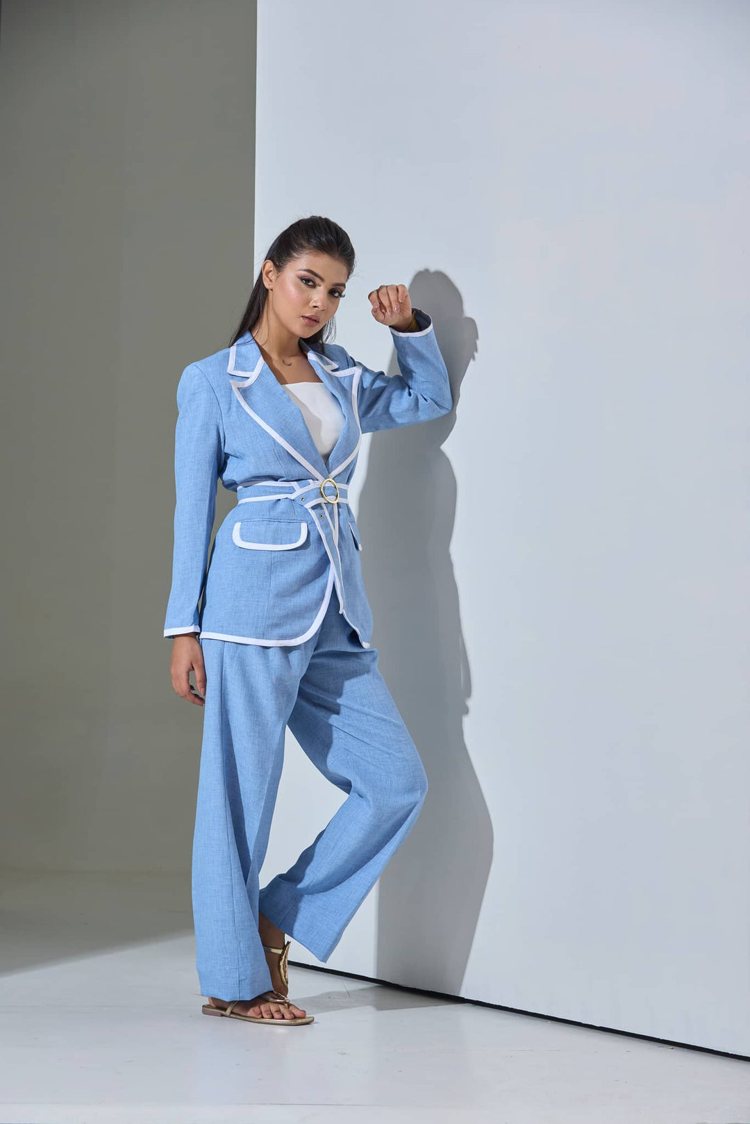 Light blue women's co-ord set for office featuring a fitted blazer with white trim and wide-leg pants