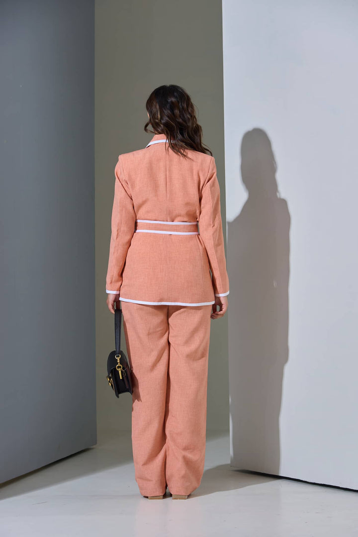 Back view of a salmon women's co-ord set for office in linen blend with a tailored fit and white accents