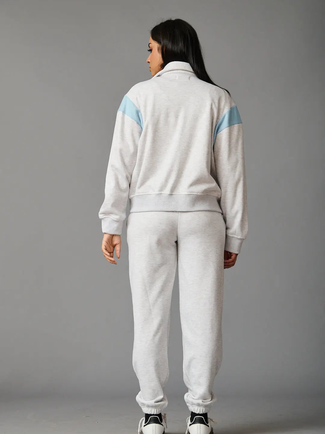 Risate women's co-ord set in gray with light blue accents, featuring a stylish zip-up jacket and matching pants