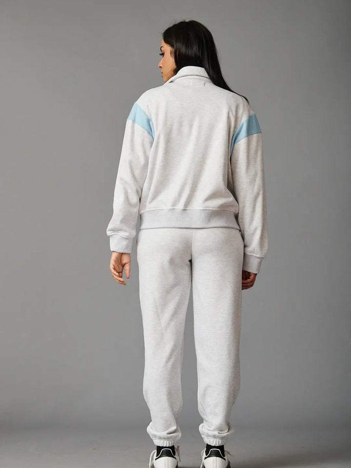 Risate women's co-ord set in gray with light blue accents, featuring a stylish zip-up jacket and matching pants