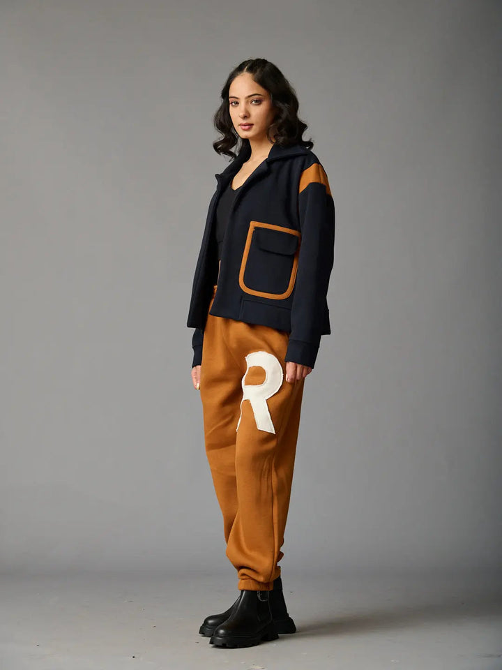 Risate women's co-ord set featuring a navy jacket with pockets and brown joggers with a logo